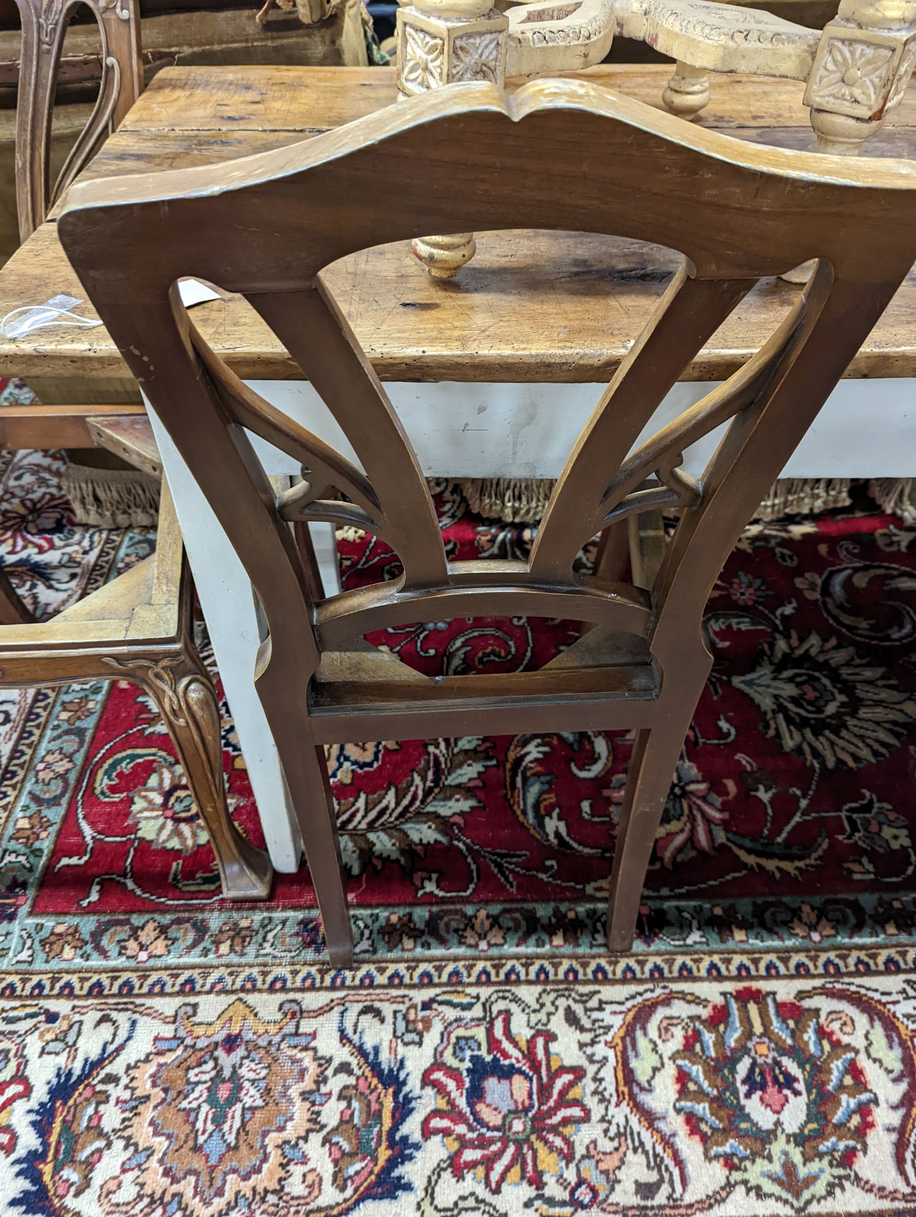 A set of six Majorelle style mahogany dining chairs (no seats). H-92cm.